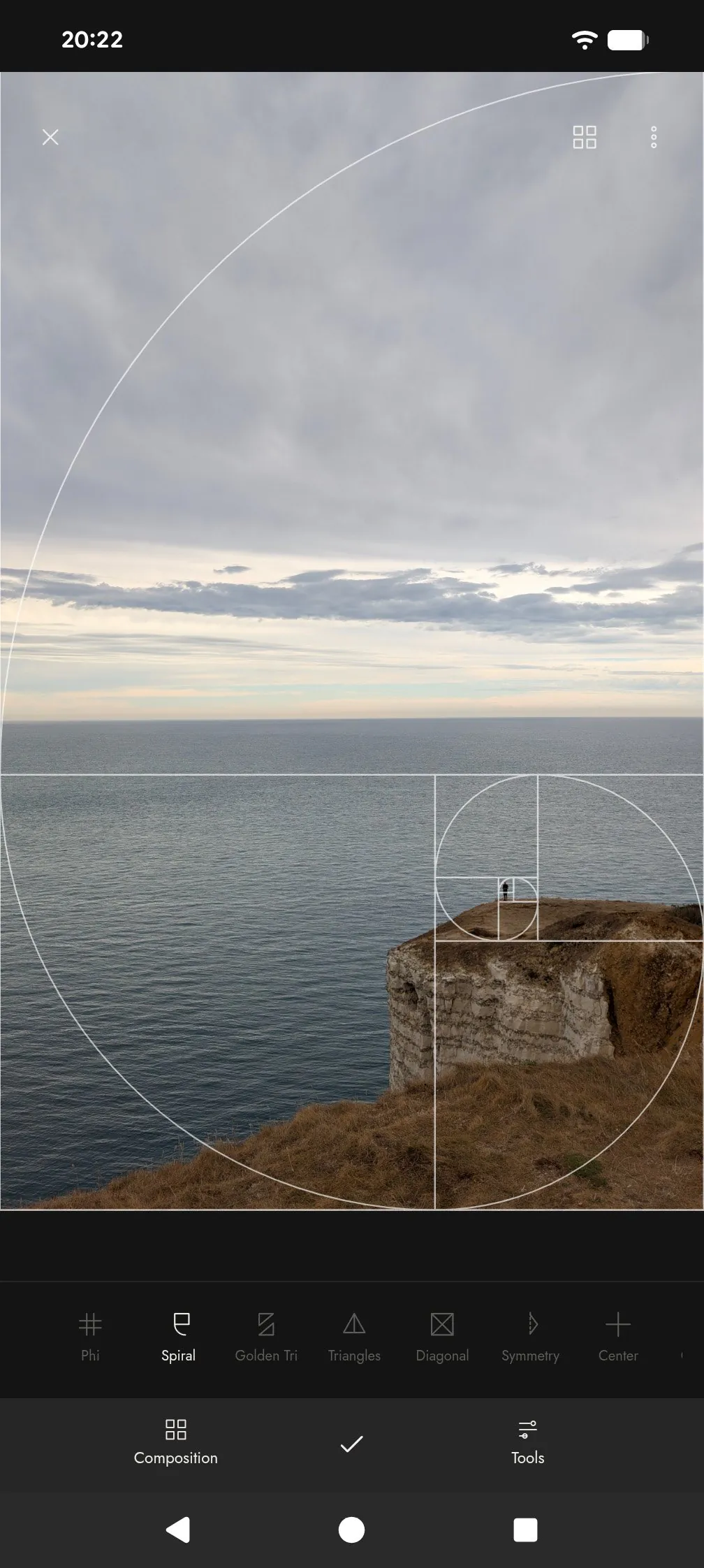 Golden spiral composition guide over a cliff and the sea